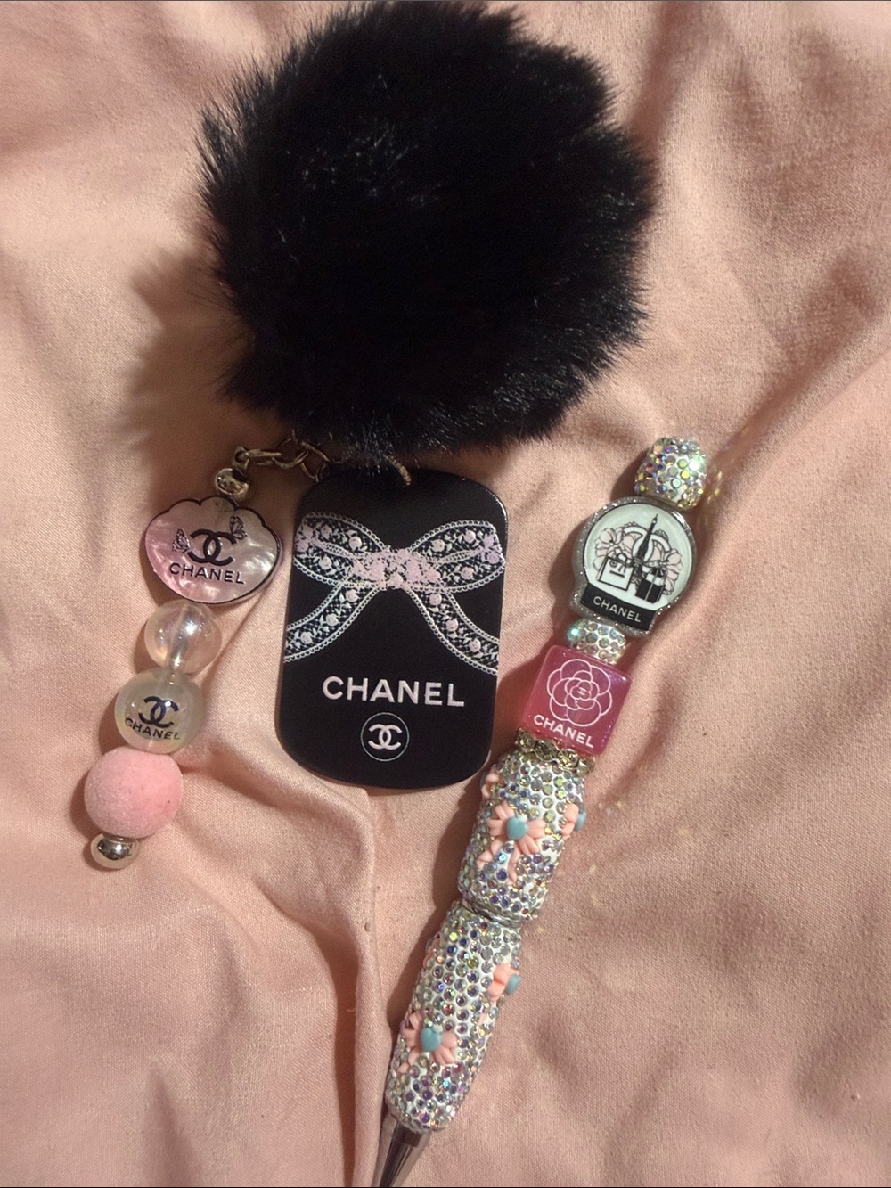 Black & pink matching keychain and rhinestone pen with extra pen refill.